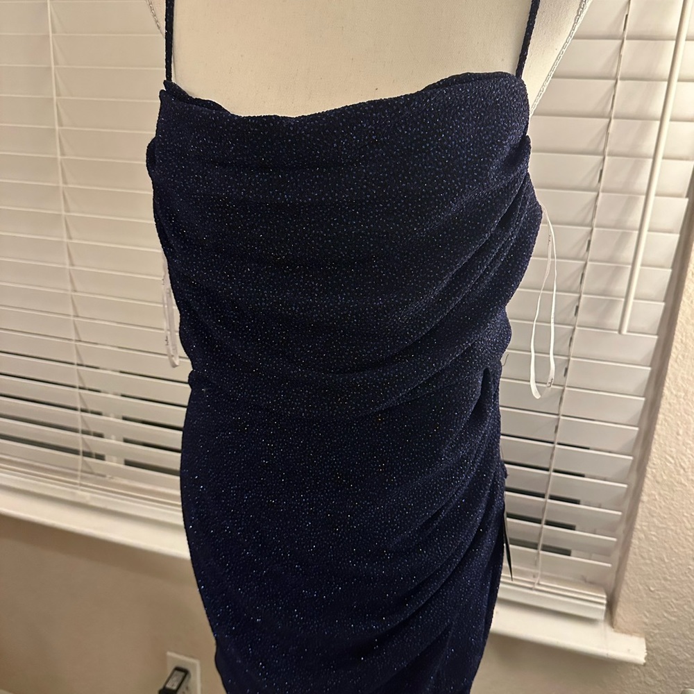 Brand new with tags, adjustable strap Navy dress with sparkles throughout!